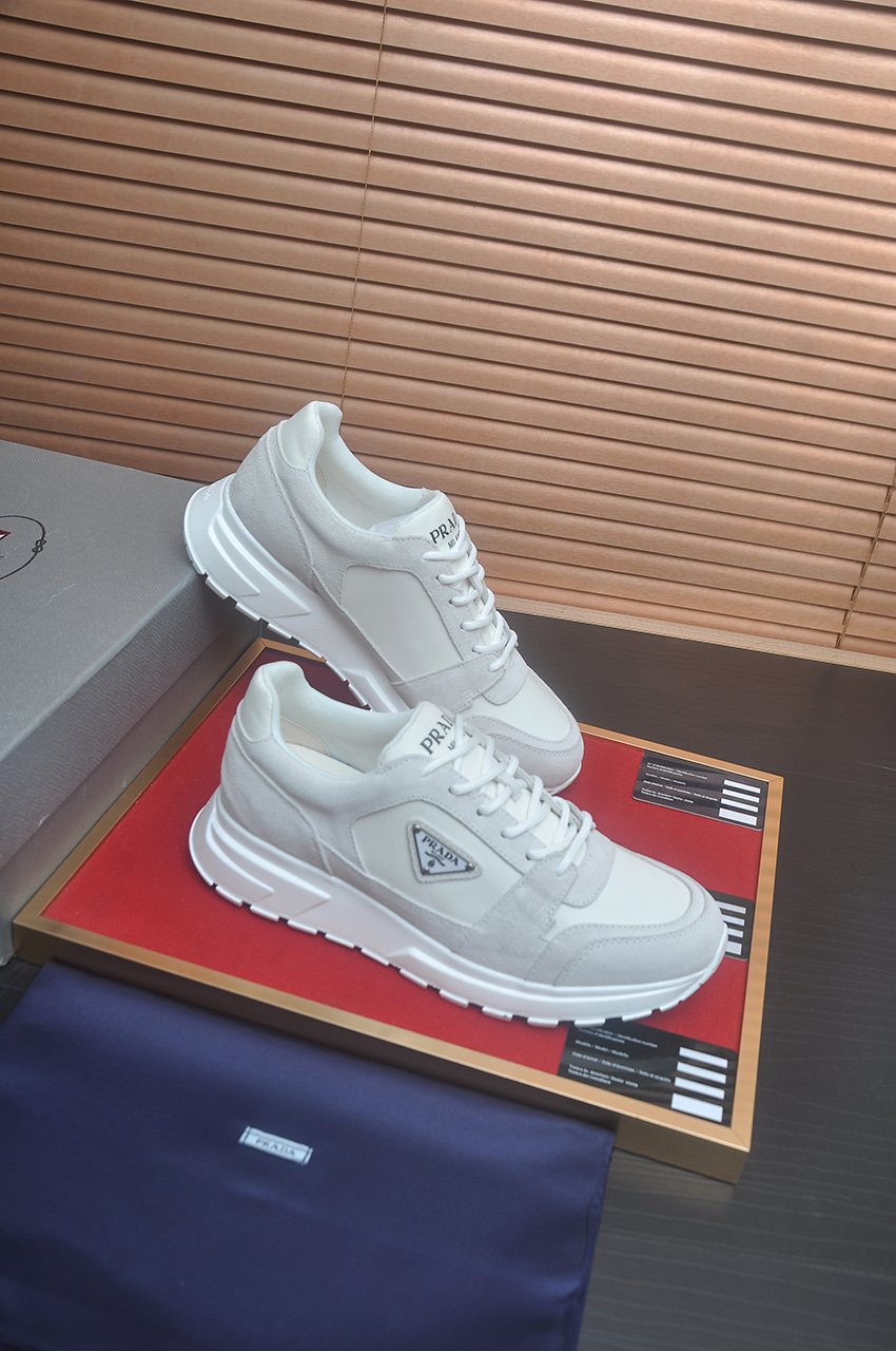 Prada Triangle Plaque Low-Top Sneakers — front