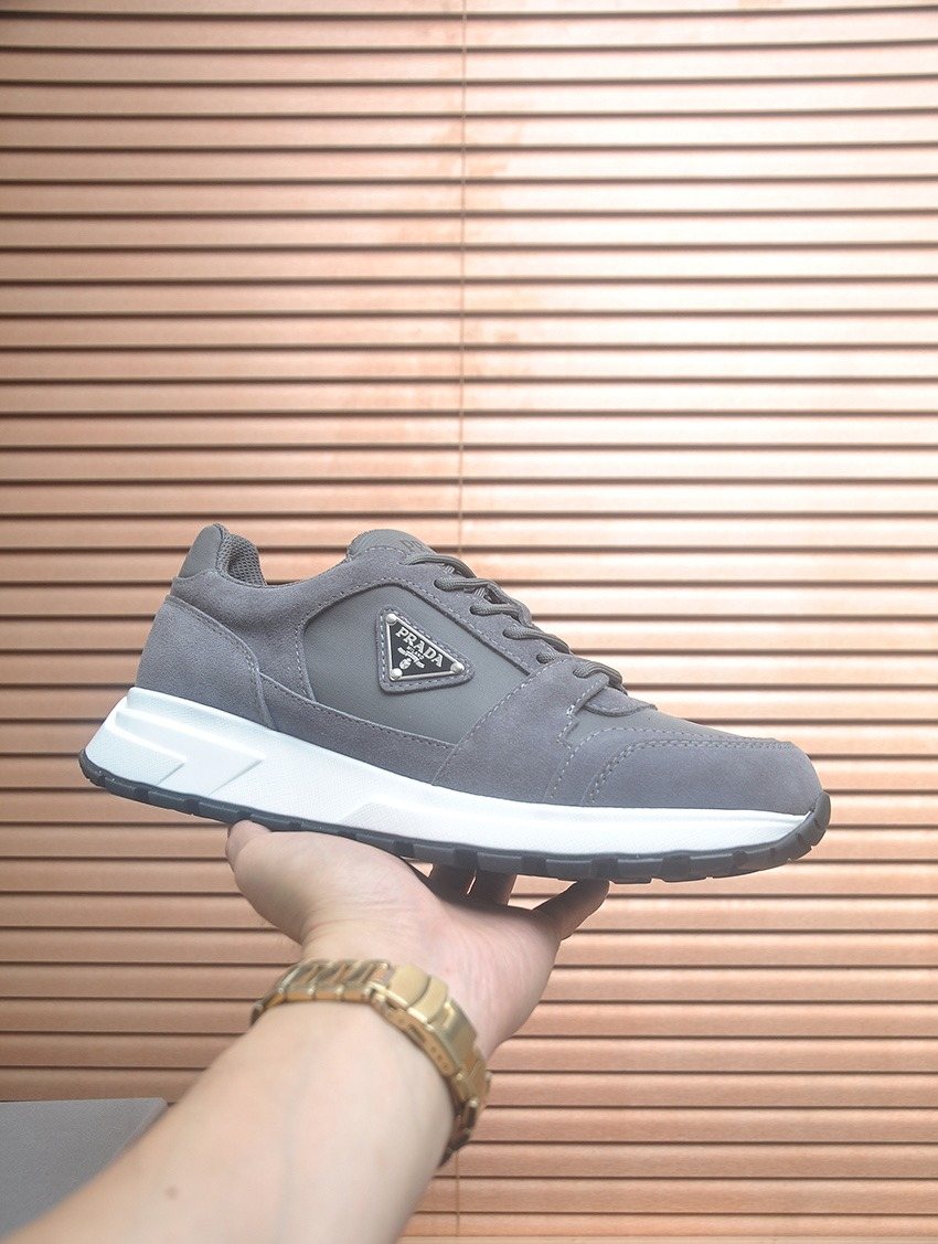 Prada Triangle Plaque Low-Top Sneakers — front